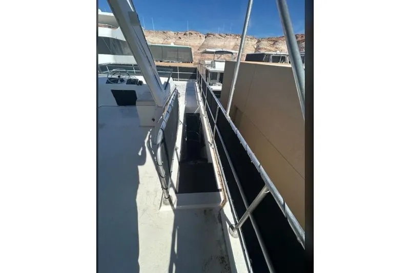 Slide: The Image of 2007 Sumerset Lakeview HD houseboat deck with railing and scenic background. - 37