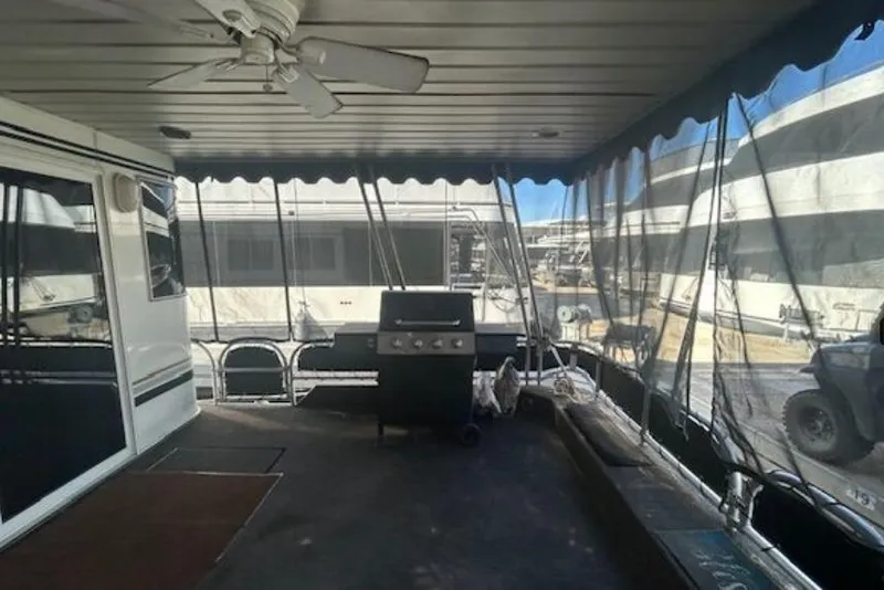 Slide: The Image of 2007 Sumerset Lakeview HD houseboat deck with grill and ceiling fan. - 8