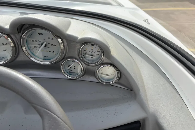 Slide: The Image of Dashboard of a 2011 Bayliner 185 boat showing speedometer and fuel gauges. - 25