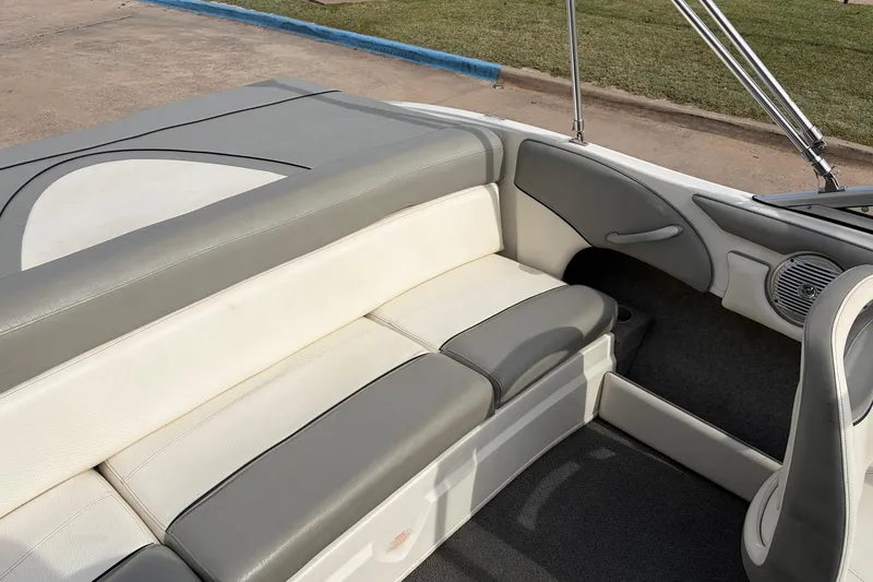 Slide: The Image of 2011 Bayliner 185 boat interior with gray and white seating. - 28