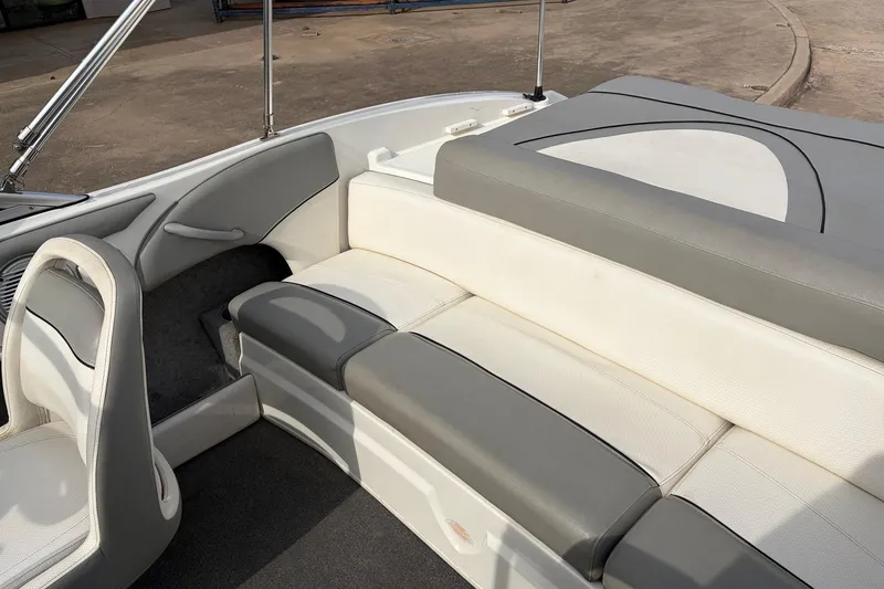 Slide: The Image of 2011 Bayliner 185 boat interior with gray and white seating. - 29