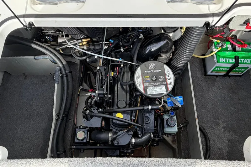 Slide: The Image of 2011 Bayliner 185 boat engine compartment with MerCruiser 3.0L engine and Interstate battery. - 33