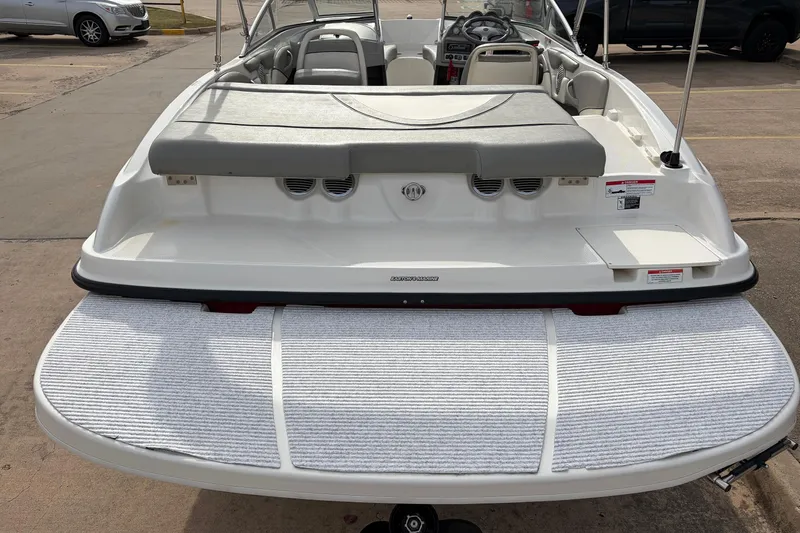 Slide: The Image of 2011 Bayliner 185 boat rear view with swim platform and seating area. - 8