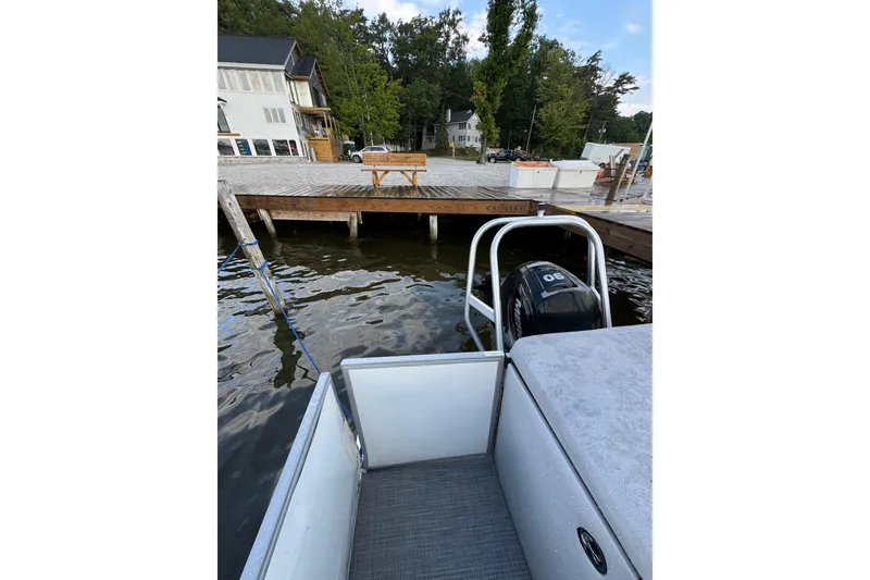 Slide: The Image of 2019 Bentley Pontoons 220/223 Cruise docked by a wooden pier on a calm lake. - 11