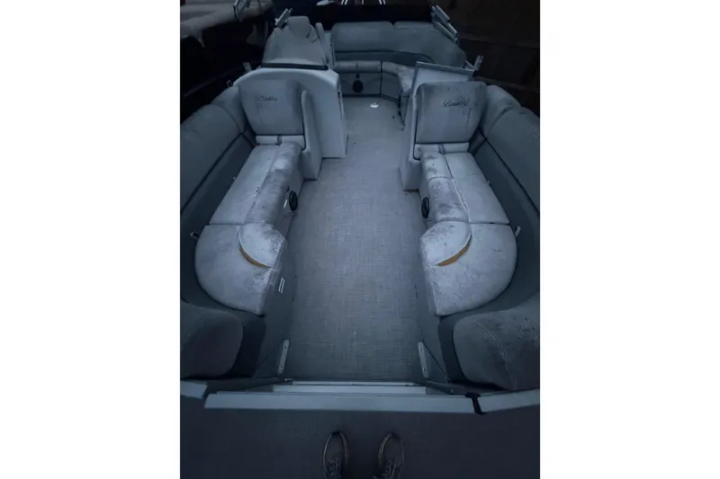 Slide: The Image of 2019 Bentley Pontoons 220/223 Cruise interior with gray seating and carpeted floor. - 7