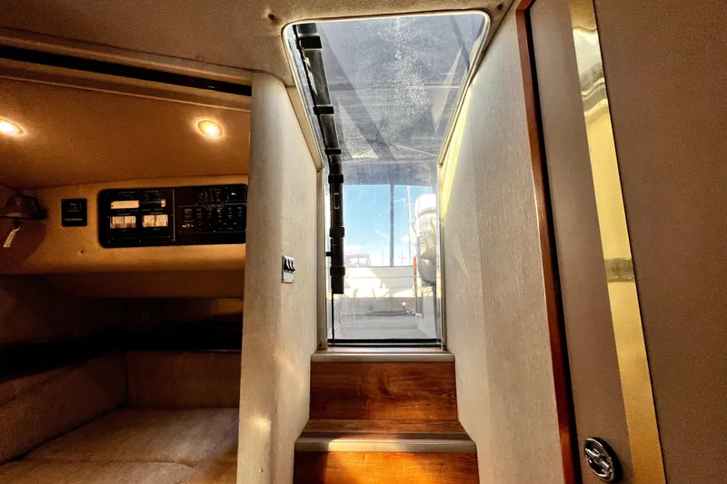 Slide: The Image of Interior view of 1989 Cruisers Yachts 3670 Esprit, showing cabin stairs and control panel. - 18
