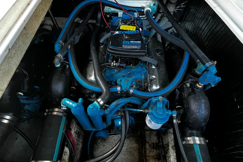 Slide: The Image of Engine compartment of 1989 Cruisers Yachts 3670 Esprit with visible blue components. - 29