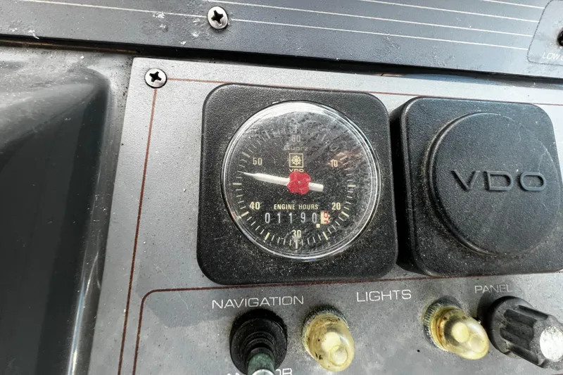 Slide: The Image of 1989 Cruisers Yachts 3670 Esprit dashboard with VDO engine hour meter reading 1190 hours. - 12