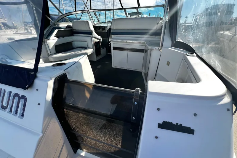 Slide: The Image of 1989 Cruisers Yachts 3670 Esprit interior with seating and helm, showcasing spacious design. - 5