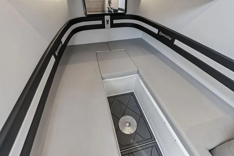 Slide: The Image of Interior of 2020 Mystic M4200 boat, featuring sleek seating and storage compartments. - 38