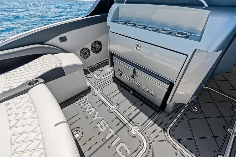 Slide: The Image of Luxurious interior of 2020 Mystic M4200 powerboat with sleek seating and storage. - 22