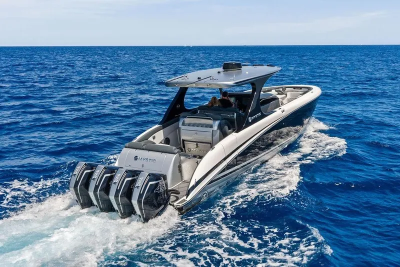 Slide: The Image of 2020 Mystic M4200 boat cruising on open blue ocean waters. - 3