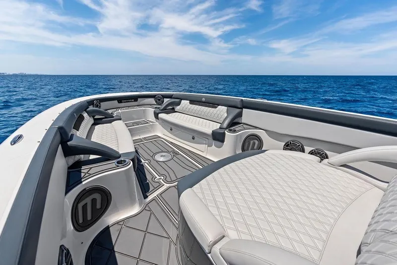 Slide: The Image of Luxurious 2020 Mystic M4200 boat interior with plush seating and ocean view. - 15
