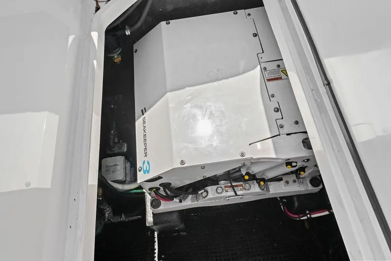 Slide: The Image of Engine compartment of a 2020 Mystic M4200 boat featuring a Seakeeper 3 stabilizer. - 36