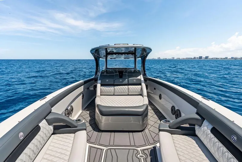 Slide: The Image of Luxurious 2020 Mystic M4200 boat interior on open sea, showcasing elegant seating and modern design. - 19
