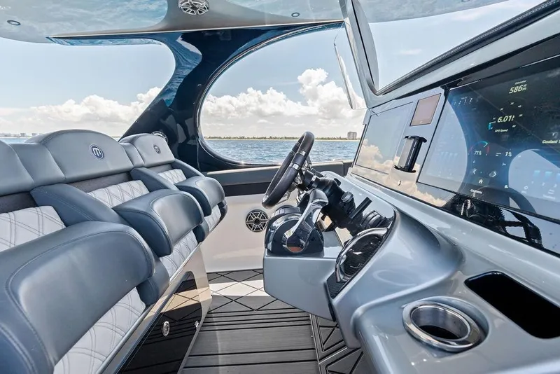 Slide: The Image of Luxurious 2020 Mystic M4200 yacht interior with advanced navigation system and plush seating. - 29