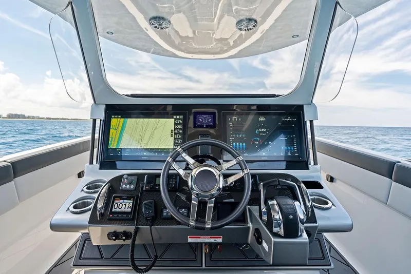Slide: The Image of Cockpit of 2020 Mystic M4200 boat with advanced navigation and control systems. - 25
