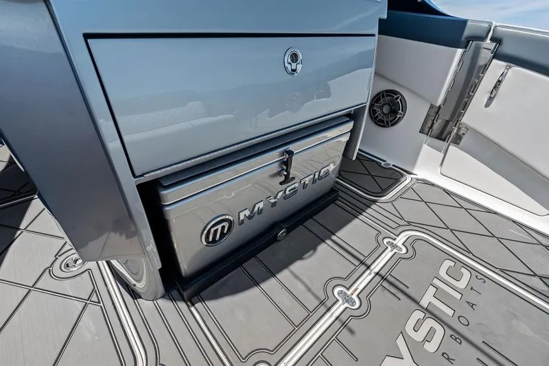 Slide: The Image of Interior of 2020 Mystic M4200 boat showcasing storage and sleek design. - 23