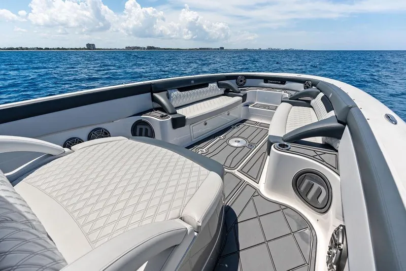 Slide: The Image of Luxurious 2020 Mystic M4200 boat interior with elegant seating on open water. - 14