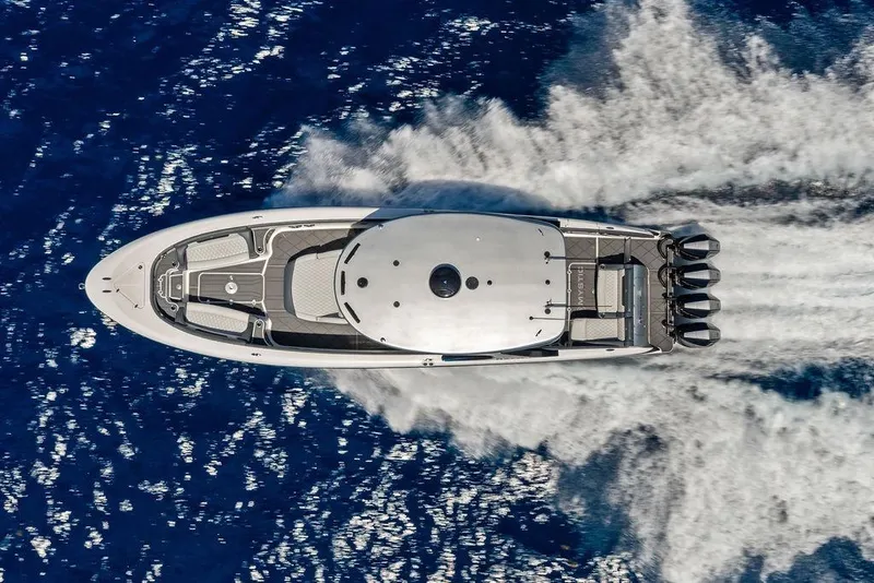 Slide: The Image of Aerial view of 2020 Mystic M4200 yacht speeding on blue ocean waters. - 4