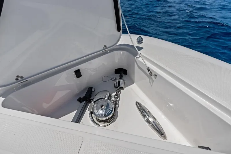 Slide: The Image of Anchor compartment of 2020 Mystic M4200 boat with ocean backdrop. - 18