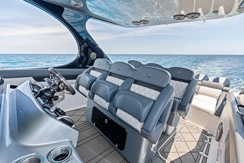 Slide: The Image of Luxurious 2020 Mystic M4200 boat interior with plush seating and ocean view. - 27