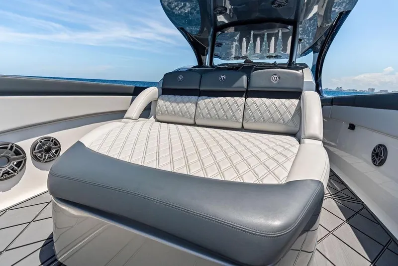 Slide: The Image of Luxurious seating on a 2020 Mystic M4200 boat with diamond-stitched upholstery. - 20