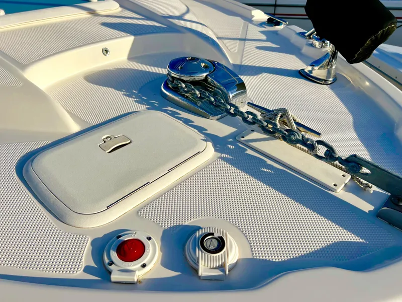 Slide: The Image of 2008 Bayliner 320 boat docked at marina under clear blue sky. - 12