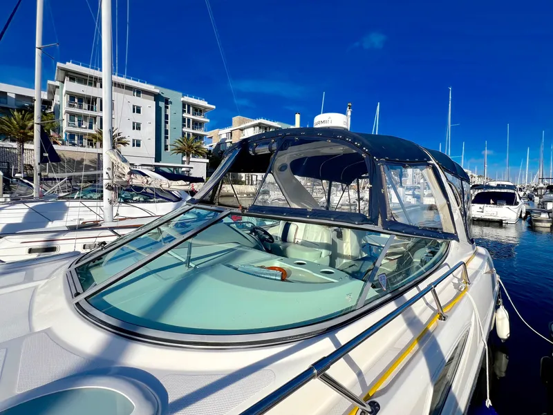 Slide: The Image of 2008 Bayliner 320 boat with anchor at marina dock. - 13