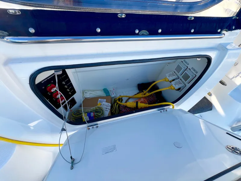 Slide: The Image of 2008 Bayliner 320 boat deck with anchor chain and control buttons. - 14