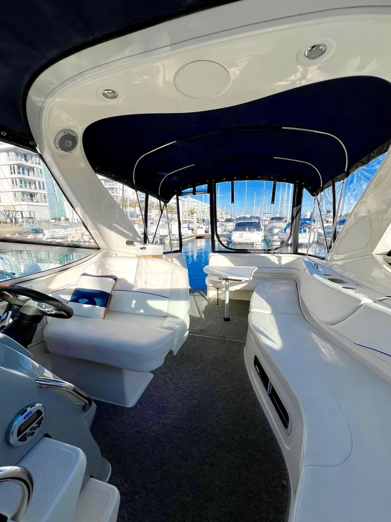 Slide: The Image of 2008 Bayliner 320 boat cockpit with steering wheel and control panel. - 23