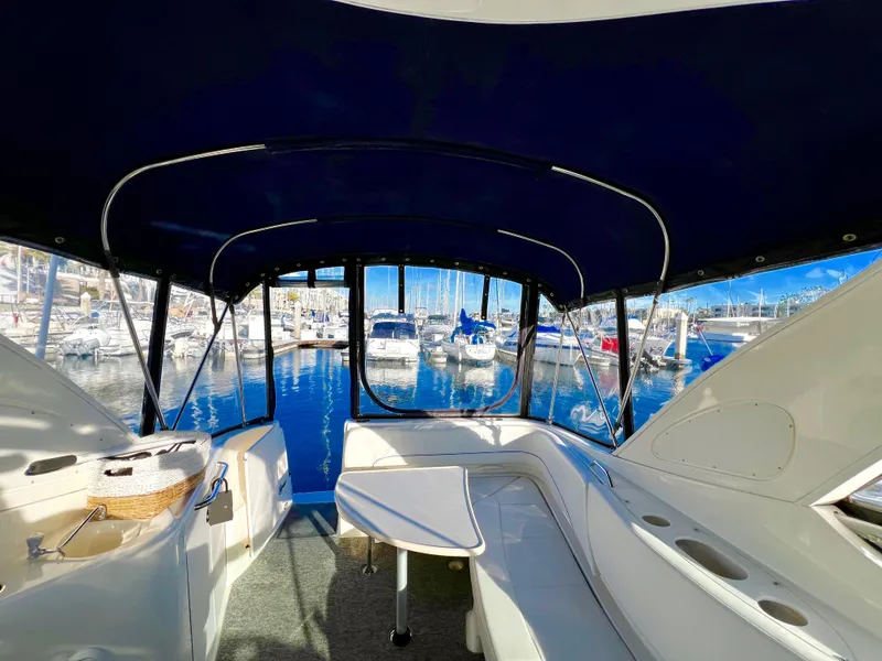 Slide: The Image of 2008 Bayliner 320 cockpit with modern controls and panoramic marina view. - 24