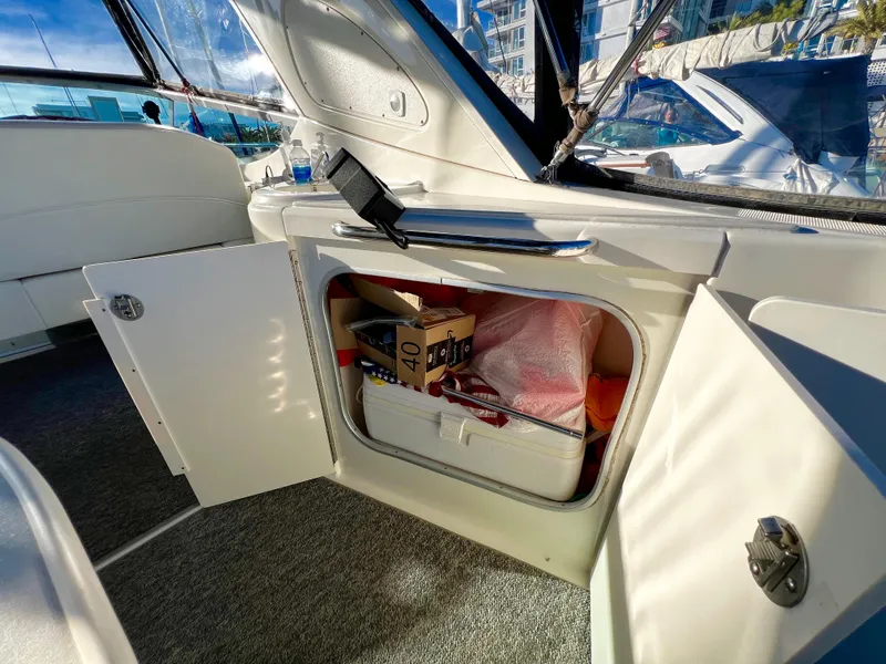 Slide: The Image of Interior view of 2008 Bayliner 320 boat with marina background. - 26