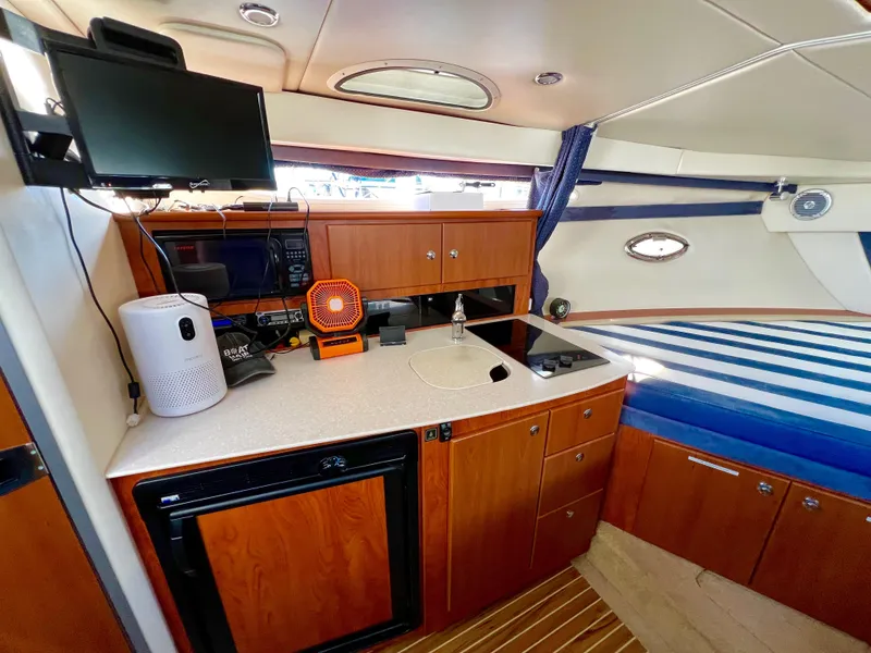 Slide: The Image of Interior of 2008 Bayliner 320 boat with cozy cabin and modern amenities. - 33
