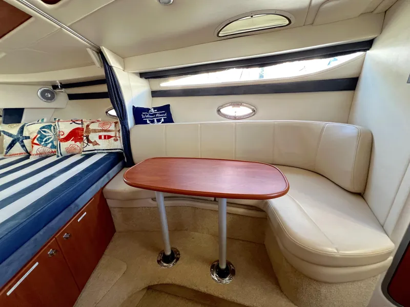 Slide: The Image of Interior of 2008 Bayliner 320 boat with kitchenette and sleeping area. - 35