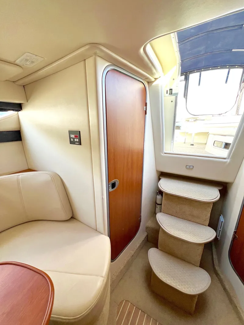 Slide: The Image of 2008 Bayliner 320 cabin storage with open shelves and life jackets. - 45