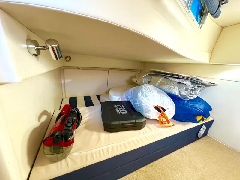 Slide: The Image of 2008 Bayliner 320 interior with wood cabinetry and control panel. - 51