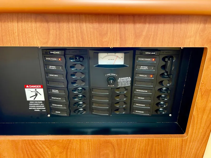 Slide: The Image of Interior cabin of 2008 Bayliner 320 boat with wooden cabinetry and carpeted flooring. - 52