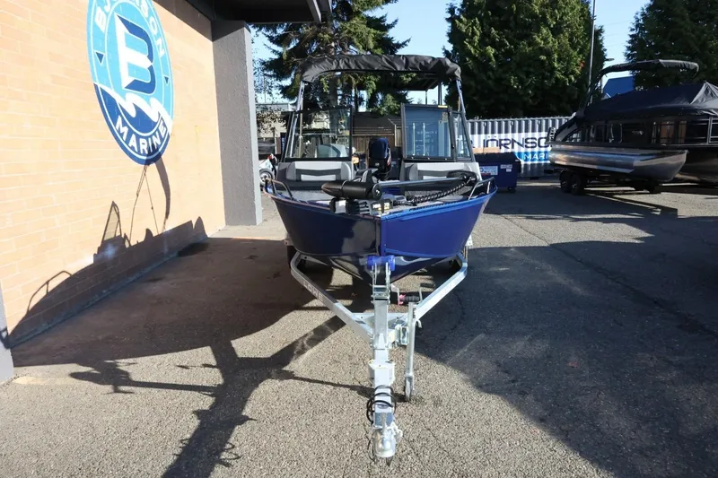 Slide: The Image of 2026 Lowe Fish & Ski 1625 boat on trailer at dealership. - 11