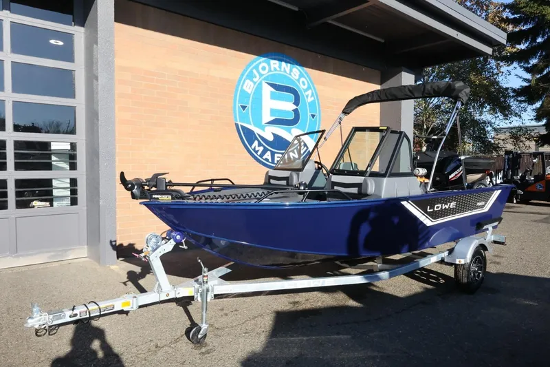 Slide: The Image of 2026 Lowe Fish & Ski 1625 boat on trailer outside Bjornson Marine. - 13