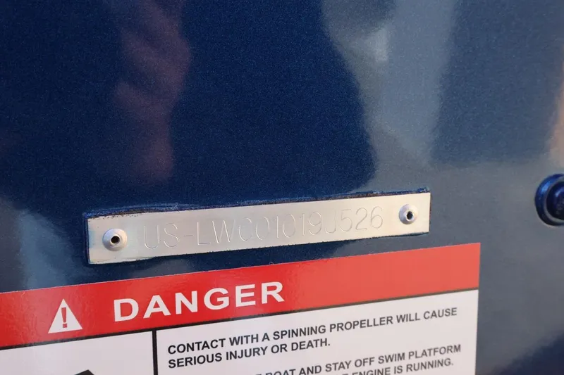 Slide: The Image of 2026 Lowe Fish & Ski 1625 boat with warning label and identification plate. - 15