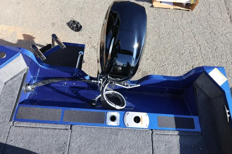 Slide: The Image of 2026 Lowe Fish & Ski 1625 boat with sleek motor and blue interior. - 19