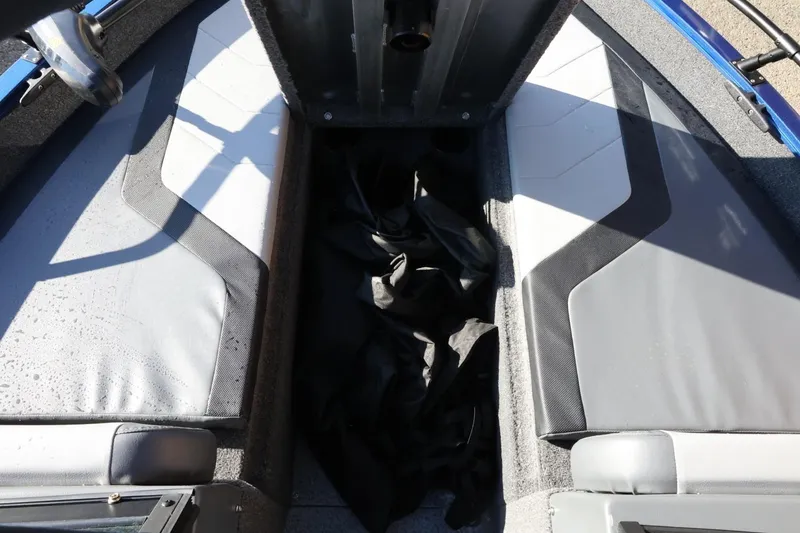 Slide: The Image of Interior view of 2026 Lowe Fish & Ski 1625 boat, featuring seating and storage area. - 34