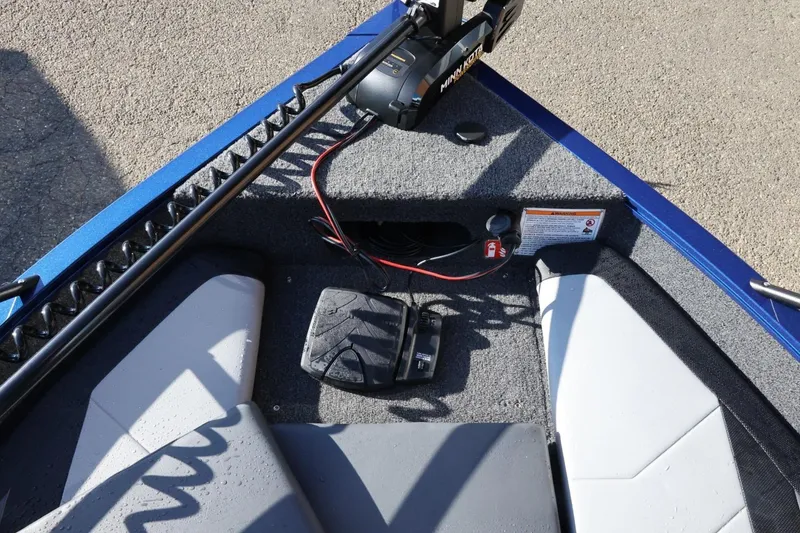 Slide: The Image of 2026 Lowe Fish & Ski 1625 boat interior with trolling motor and foot pedal. - 39