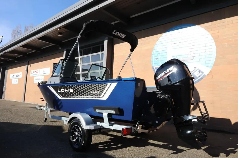 Slide: The Image of 2026 Lowe Fish & Ski 1625 boat with Mercury engine on trailer. - 4