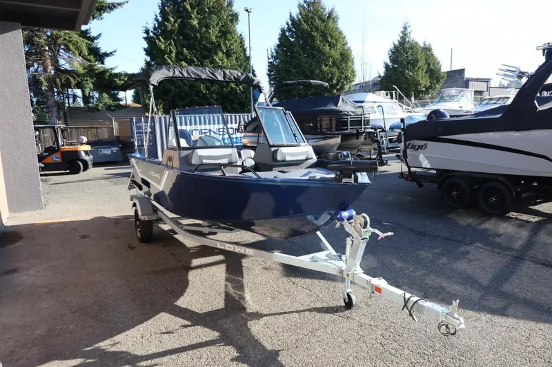 Slide: The Image of 2026 Lowe Fish & Ski 1625 boat on trailer in outdoor setting. - 9