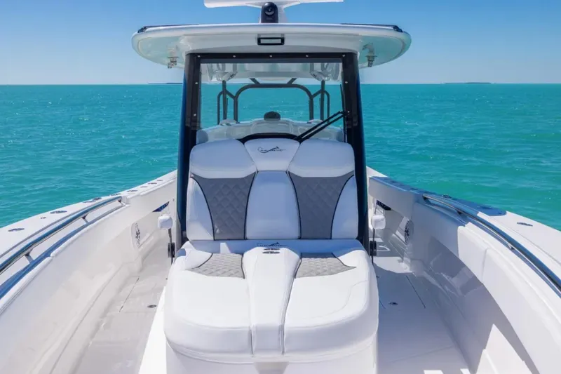 Slide: The Image of 2025 Blackwater 43 Luxury Fish boat with plush seating on turquoise waters. - 10