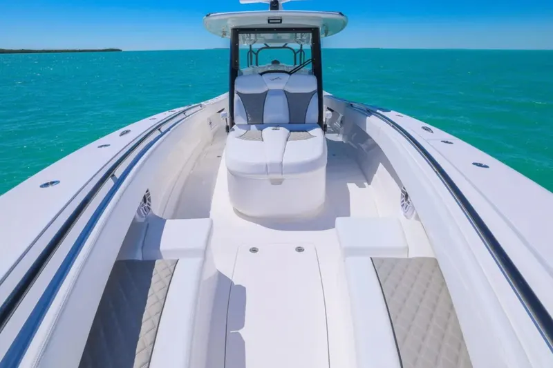 Slide: The Image of 2025 Blackwater 43 Luxury Fish boat on turquoise water, showcasing sleek design and spacious deck. - 11