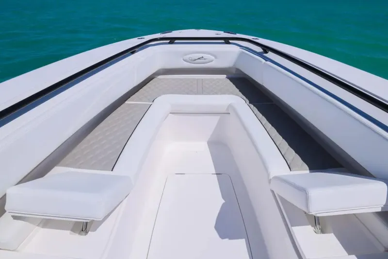 Slide: The Image of Luxurious seating on the 2025 Blackwater 43 Luxury Fish boat, surrounded by turquoise waters. - 12