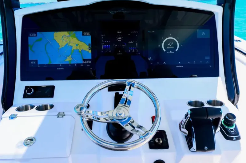 Slide: The Image of 2025 Blackwater 43 Luxury Fish boat dashboard with advanced navigation displays and controls. - 19